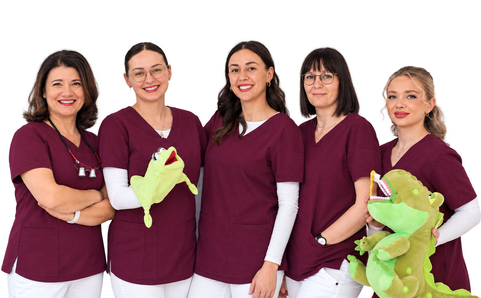 Unser Praxisteam mit zwei grünen Handpuppen.